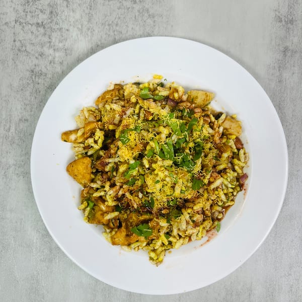 Chaat House's Pakistani Bhel Puri, a savory snack with puffed rice, vegetables, and chutney.